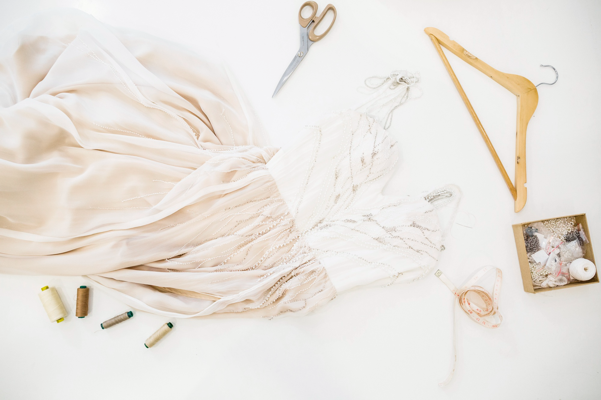 Formal gown arranged with tailoring tools